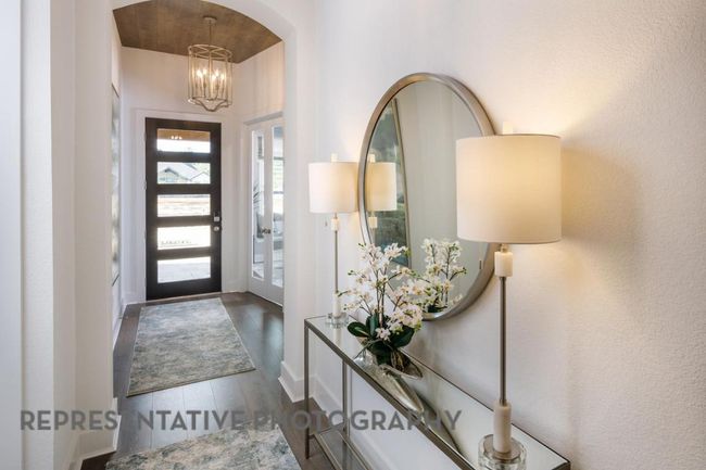 Foyer entrance with a chandelier and dark wood-style floors | Image 27