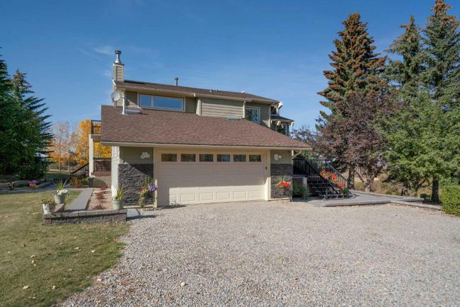 28 Poplar Hill Place, Home with 4 bedrooms, 3 bathrooms and 6 parking in Rural Rocky View County AB | Image 1