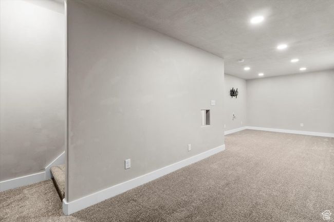 Below grade area with recessed lighting, light colored carpet, and baseboards | Image 33