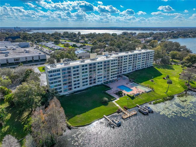 AERIAL VIEW OF CONDO AND AMENITIES. VIEW TOWARDS LAKE HOWARD! | Image 54