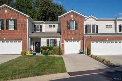 Front of townhouse with one car garage | Image 1