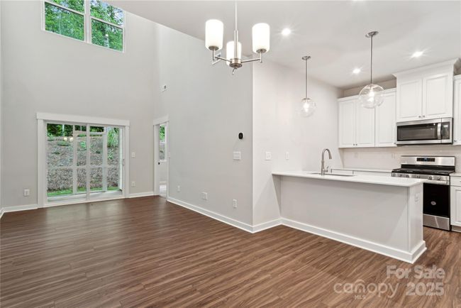 *Representative of the Norman floorplan – not the actual home* Dining area seamlessly connected to the kitchen and overlooking the impressive two-story great room. | Image 6