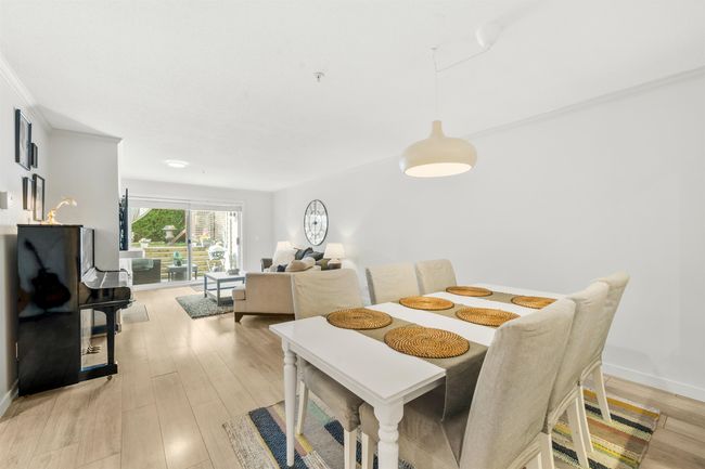 Dining room featuring light wood-style flooring and baseboards | Image 4