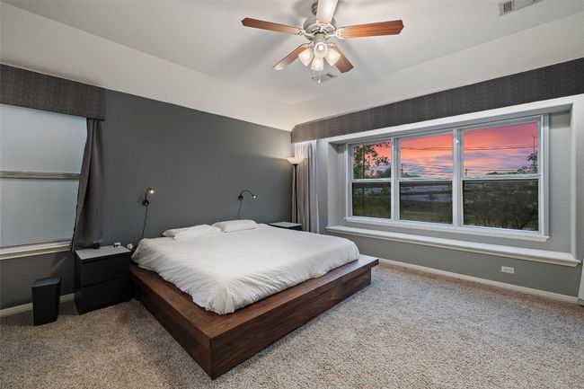 Tranquil primary suite with soundproof windows, automatic blinds, walk in closet, dual vanities, garden tub, walk in shower and private commode. | Image 19