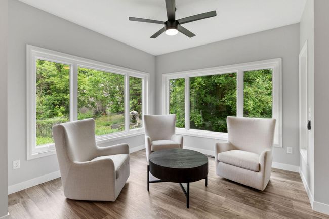 The sun room off the kitchen is the perfect relaxation spot to enjoy a cup of coffee. | Image 11