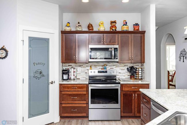 Beautiful backsplash and stainless steel appliances | Image 18