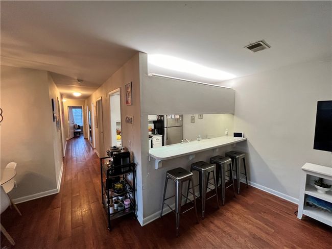 Kitchen with bar for studying or hanging out | Image 6