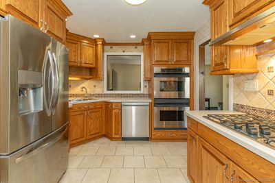 A fantastic kitchen with full cabinets to the ceiling | Image 2