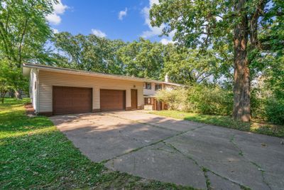 Large 28x25 insulated attached garage plus an additional 12x20 backyard detached garage. Plenty of space for parking, hobbies & storage. | Image 2