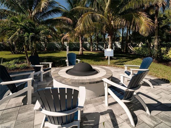 View of patio featuring an outdoor fire pit | Image 24
