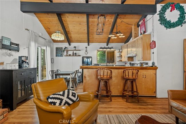 Main floor kitchen open to living room. | Image 5