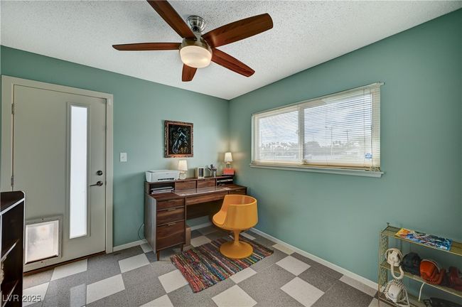 Home office featuring a ceiling fan, baseboards, a textured ceiling, and tile patterned floors | Image 33