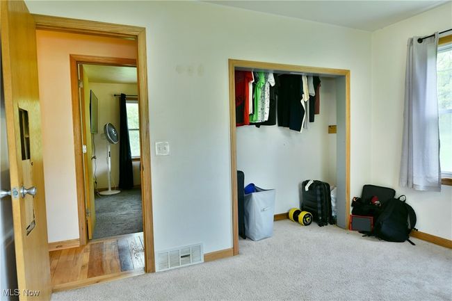 Bedroom with carpet flooring and baseboards | Image 30