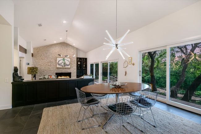 Expansive glass doors open not the greenbelt-like backyard | Image 9