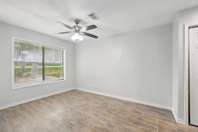 Conveniently located off the kitchen, this space makes it easy to serve up meals and stay engaged with what’s happening in the home. | Image 18