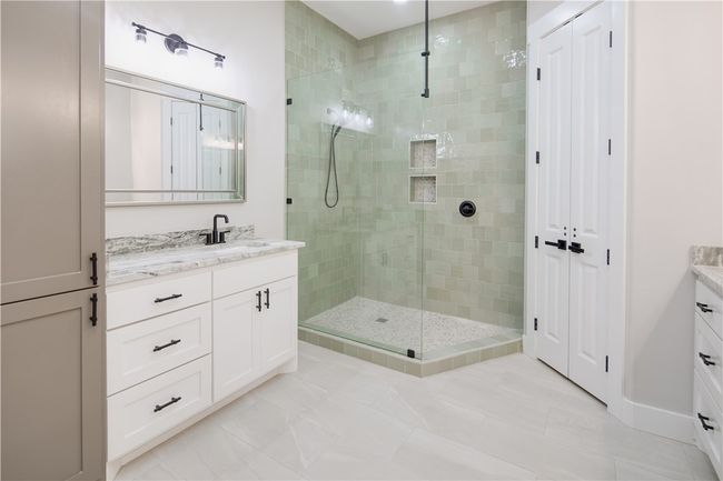 Bathroom featuring vanity and a shower stall | Image 12