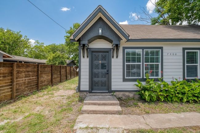 View of exterior entry featuring a shingled roof | Image 16