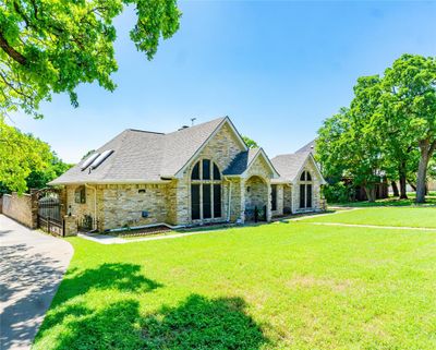 View of front facade with a front lawn from street view | Image 2