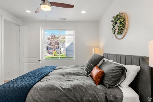 Bedroom featuring visible vents, recessed lighting, and a ceiling fan | Image 13