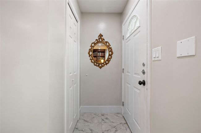Doorway featuring marble finish floor and baseboards | Image 9