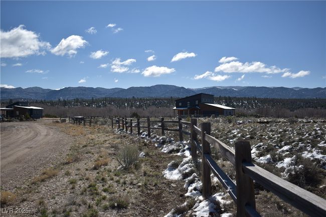 View of mountain backdrop featuring rural landscape | Image 15