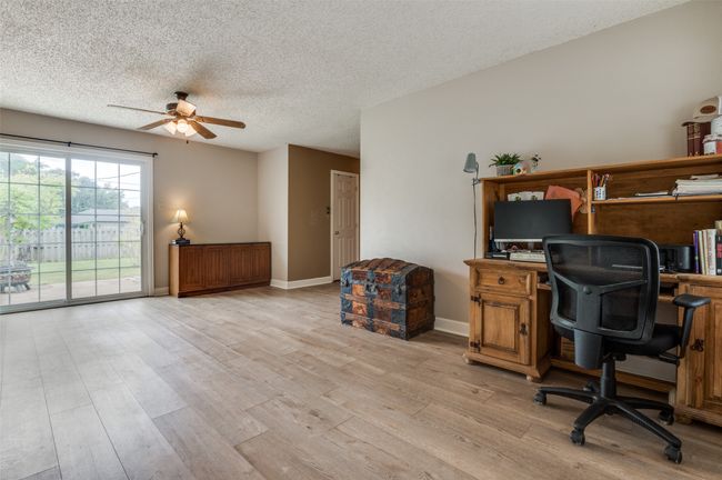 Office featuring baseboards, ceiling fan, light wood finished floors, and a textured ceiling | Image 6