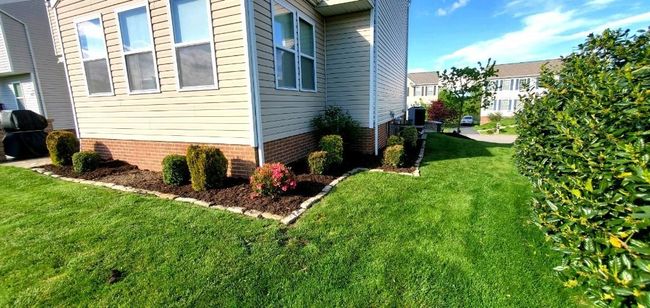 Side/back yard. Landscaping goes around the entire perimeter. | Image 44