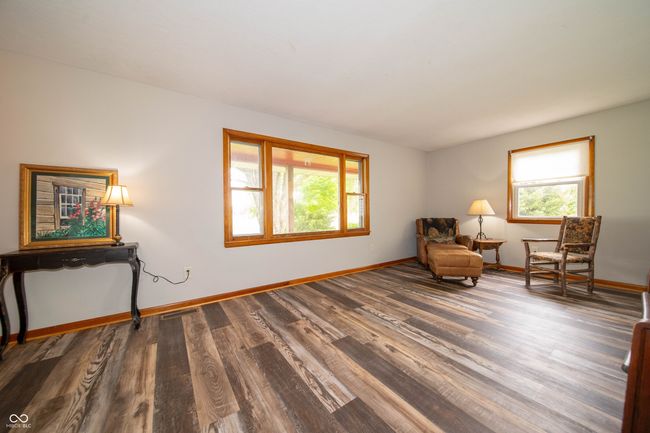 living area with wood finished floors and baseboards | Image 10