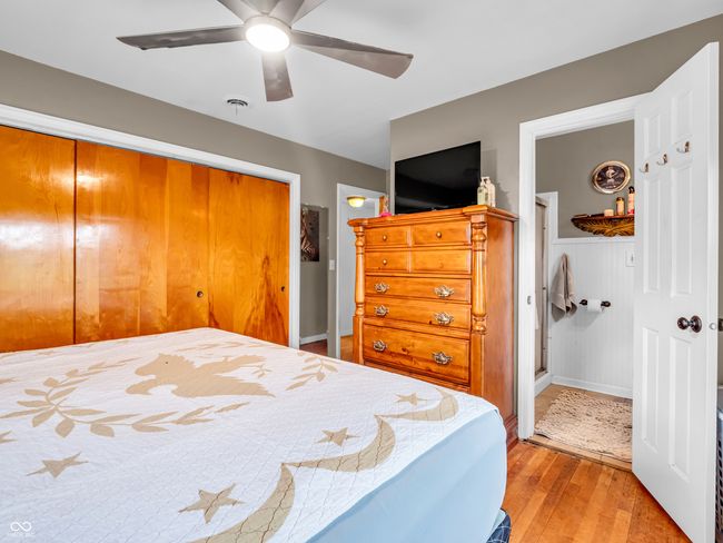 bedroom featuring a ceiling fan, light wood-style floors, and a closet | Image 25