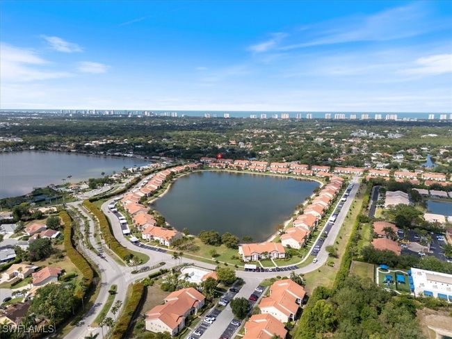 Drone / aerial view featuring a water view, a residential view, and a city view | Image 15