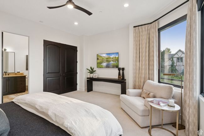 Bedroom with recessed lighting, ensuite bath, ceiling fan, and light carpet | Image 58
