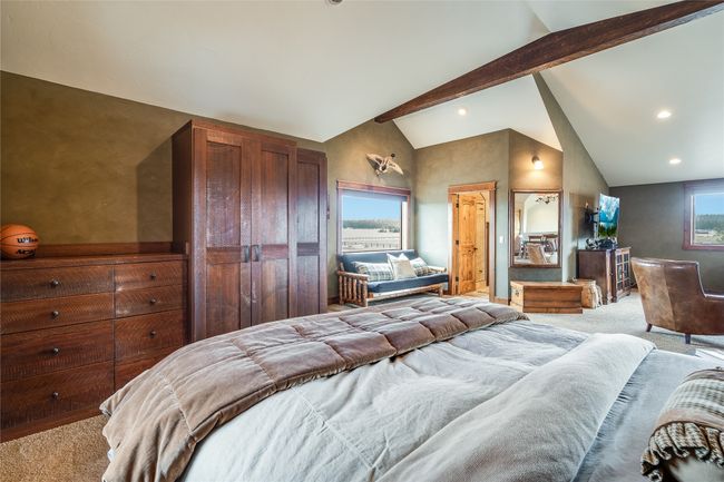 Caretaker Quarters / Guest House. Bedroom featuring beamed ceiling, multiple windows, carpet, and high vaulted ceiling | Image 81