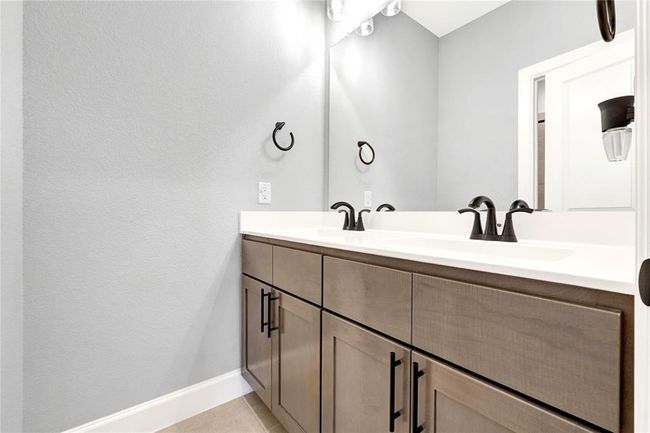 Second floor bathroom with double sinks with separate door to shower. Upgraded cabinet hardware and faucets | Image 42