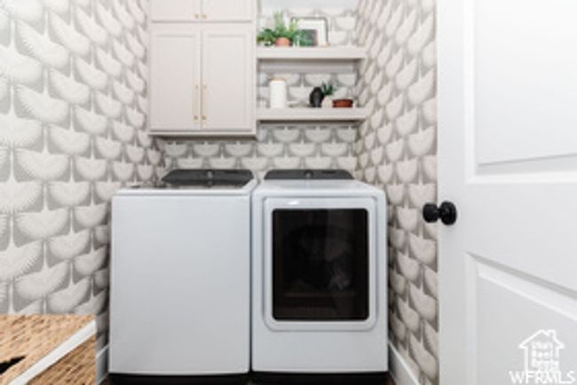 Laundry area with cabinet space and washing machine and clothes dryer | Image 29