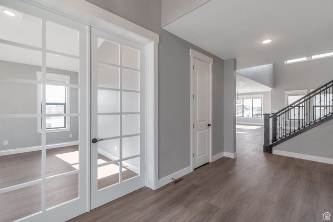 Foyer featuring wood finished floors, stairs, and recessed lighting | Image 7