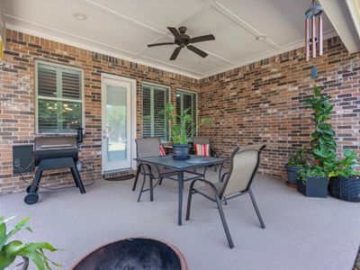 The covered patio is generously sized, providing ample space for various outdoor activities. | Image 3