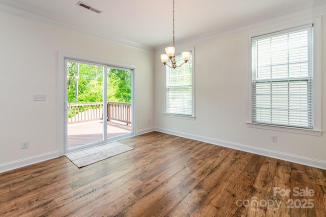 Eat in kitchen opens to deck and fenced yard | Image 19