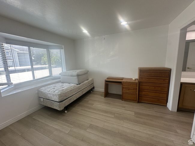 Sitting room featuring light wood-style floors and recessed lighting | Image 10