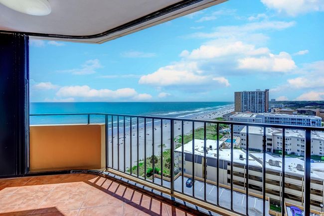 Balcony with a beach view and a water view | Image 15