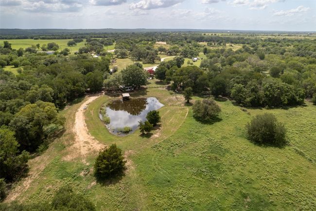 Aerial view of property's location featuring a nearby body of water | Image 25