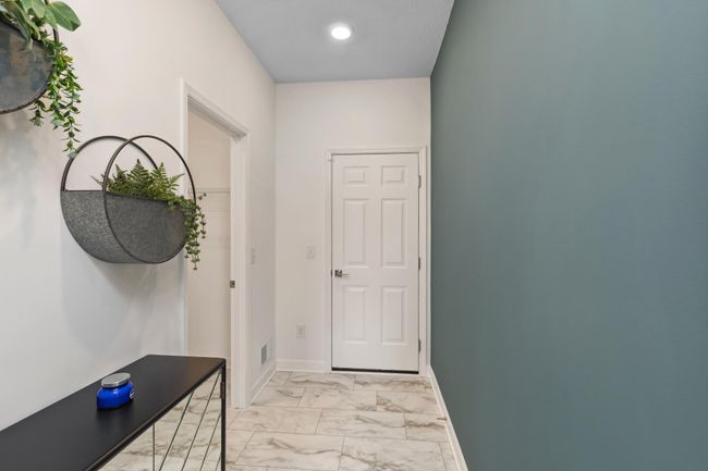 Photo is of the actual model. The mudroom is just off the kitchen. | Image 12