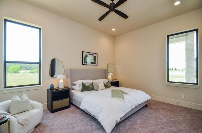One of 3 bedrooms downstairs. All with ensuite baths. | Image 9