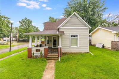 Bungalow-style home featuring a front lawn and a porch | Image 2