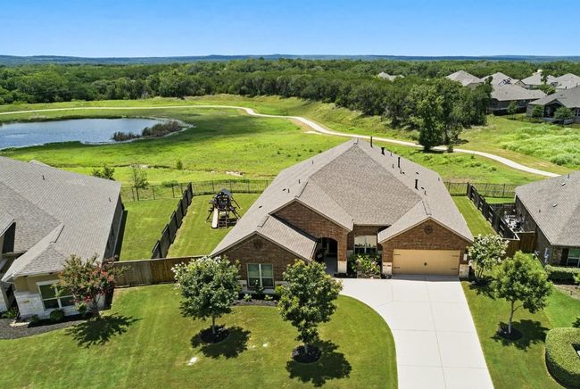 Aerial view of property and surrounding area with a large body of water | Image 35