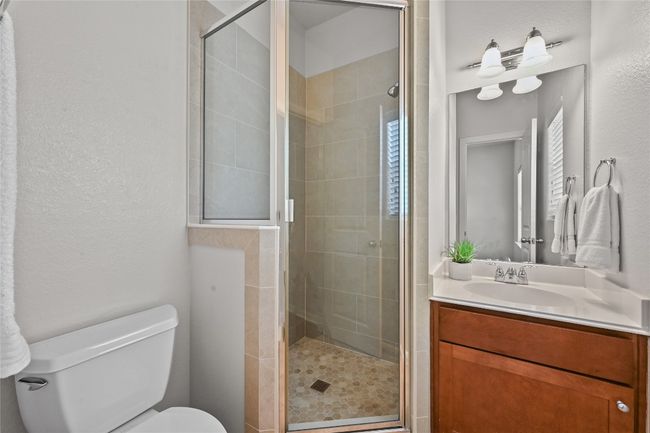 Guest bathroom with walk in shower located in the second bedroom | Image 21