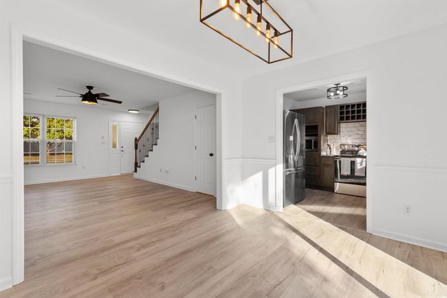 Kitchen featuring dishwasher, a sink, dark brown cabinetry, and decorative backsplash | Image 9