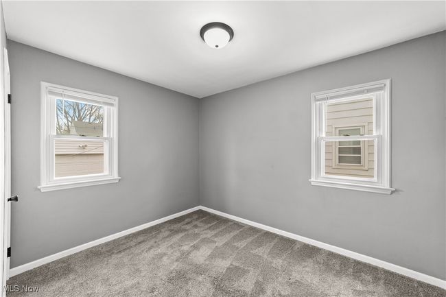Bedroom with carpet floors and baseboards | Image 13
