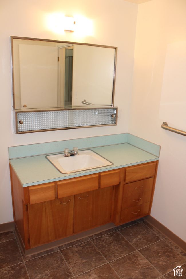 Bathroom featuring vanity and baseboards | Image 22