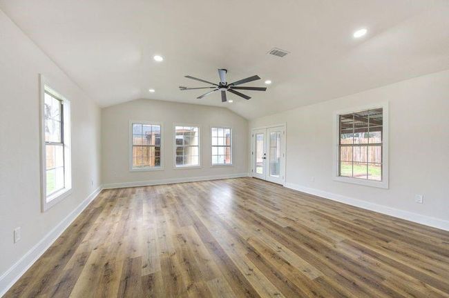 Wonderful Family Room with French Doors that open onto a covered patio. | Image 11