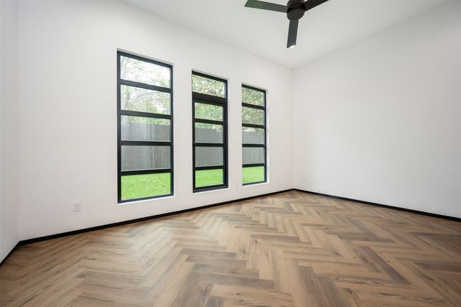 Spare room featuring a ceiling fan and baseboards | Image 22